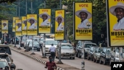 Billboards of Uganda's President Yoweri Museveni who is running for his 6th presidential term are seen on a street in Kampala, Jan. 4, 2021.