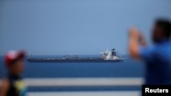 The oil supertanker Grace 1, that's on suspicion of carrying Iranian crude oil to Syria, sits anchored in waters of the British overseas territory of Gibraltar, historically claimed by Spain, July 4, 2019. 