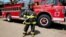 Yolaina Chavez Talavera, 31, a firefighter, poses for a photograph in front of a truck at a fire station in Managua, Nicaragua, Feb. 22, 2017. "In my early days as a female firefighter, men, my teammates, thought that I would not last long in the organization due to the hard training," she said. "However, in practice I showed them that I am able to take on tasks at the same level as men. I think women must fight to break through in all areas, in the midst of the machismo that still persists in Nicaragua and in Hispanic countries."