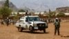 FILE - Rwandan peacekeepers, part of the U.N.-African Union mission in Darfur (UNAMID), stand guard in the town of Golo, in central Darfur, Sudan, June 19, 2017. The peacekeepers recently handed over 14 Darfur bases to Sudan's control.