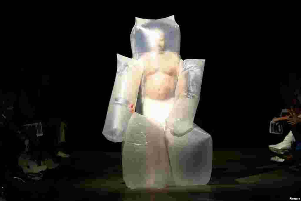 A model presents creations during the University of Westminster MA catwalk show at London Fashion Week Men's in London, June 9, 2019. 