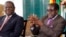 Zimbabwean President Robert Mugabe (R) and Prime Minister Morgan Tsvangirai address a media conference in Harare, January 17, 2013.