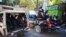 FILE - Police patrol after recovering the bodies of at least two journalists slain by gangs in Port-au-Prince, Haiti, Jan. 7, 2022. Canadian Prime Minister Justin Trudeau said Jan. 21, 2022, that Haiti's allies must help tackle violence that is worsening its humanitarian crisis.