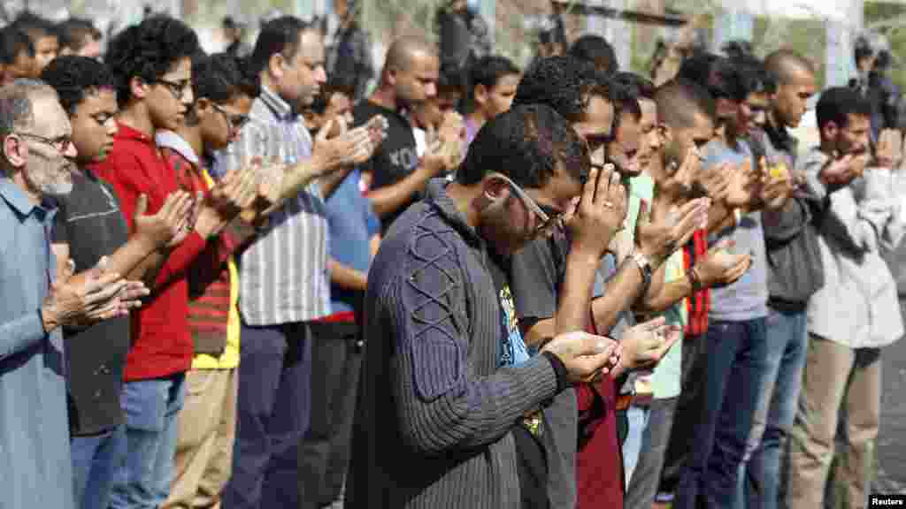 Supporters of Egyptian President Mohamed Morsi pray outside the police academy, where Morsi's trial took place, in Cairo, Nov. 4, 2013. 