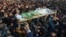 People attend a funeral of a Pakistani girl who was raped and killed, in Kasur, Pakistan, Jan. 10, 2018. Pakistani police said a mob angered over the crime attacked a police station in eastern Punjab province, triggering clashes that left at least two peo
