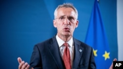 FILE - Jens Stoltenberg, NATO Secretary-General, speaks at a press statement in Berlin, Germany, Aug. 26, 2020. 