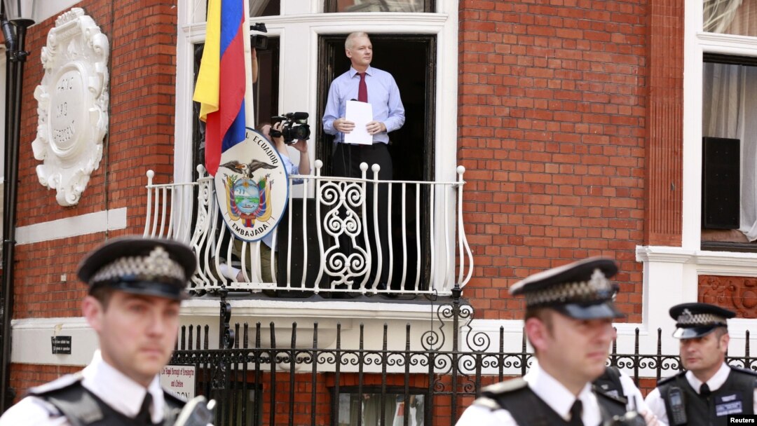WikiLeaks founder Julian Assange steps onto the balcony before speaking to the media outside the Ecuador embassy in west London, August 19, 2012.