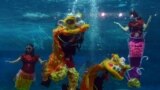 Indonesian performers dressed as mermaids wearing traditional Chinese cheongsam dress and a lion perform underwater in a special program celebrating the Lunar New Year at Jakarta&#39;s Ancol park, Indonesia.