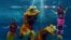 Indonesian performers dressed as mermaids wearing traditional Chinese cheongsam dress and a lion perform underwater in a special program celebrating the Lunar New Year at Jakarta's Ancol park, Indonesia.