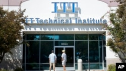 FILE - Students find the doors locked to the ITT Technical Institute campus in Rancho Cordova, Calif. The U.S. Education Department says it's erasing student debt for thousands of borrowers who attended a for-profit college chain that made exaggerated cla