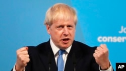 Boris Johnson speaks after being announced as the new leader of the Conservative Party in London, Tuesday, July 23, 2019. (AP Photo/Frank Augstein)