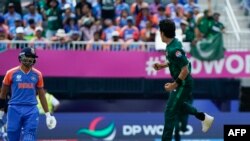 Pakistan's Naseem Shah (R) celebrates after taking his second wicket during the ICC men's Twenty20 World Cup 2024 group A cricket match between India and Pakistan at Nassau County International Cricket Stadium in East Meadow, New York on June 9, 2024. (P