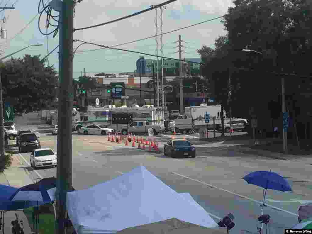 Media tents, foreground, can be seen near the Pulse nightclub in Orlando, Fla., June 14, 2016. Police still have the area cordoned off as they continue their investigation.