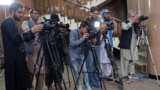 FILE - Afghan journalists attend a press conference by Afghanistan's Minister of Foreign Affairs Amir Khan Muttaqi, in Kabul on September 19, 2024.