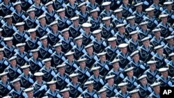 Russian sailors march toward Red Square during the Victory Day military parade marking the 75th anniversary of the Nazi defeat in Moscow, Russia.