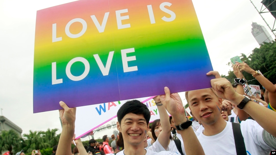 FILE - Revelers participate in a gay pride parade in Taipei, Taiwan. Taiwan is shaping up become the first place in Asia to allow same-sex marriage.