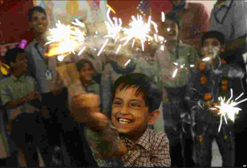 A child plays with sparklers during a pre-Diwali celebration at a school in Amritsar, India. Indians throughout the country are preparing to celebrate Diwali, the Festival of Lights, on Nov. 5. (Narinder Nanu/AFP)