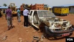 Vehicles that have been stripped for parts during looting at the China International Fund depot in Bangui, March 4, 2014. (Nick Long/VOA)