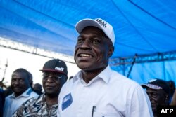 FILE - Runner up in the Democratic Republic of the Congo's presidential elections, Martin Fayulu, smiles as he arrives for a rally against the presidential results on February 2, 2019 in Kinshasa.