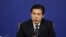 中国商务部部长钟山2018年3月11日出席记者会(路透社)