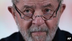 Brazil's former President Luiz Inacio Lula da Silva looks during an event with rural workers in Brasilia, March 13, 2017.