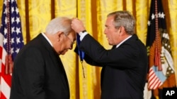 FILE - President Bush, right, presents the 2007 National Medal of Arts to author N. Scott Momaday of Oklahoma City, Nov. 15, 2007, during a ceremony in the East Room of the White House in Washington. (AP Photo/Gerald Herbert)