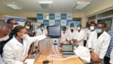 In this photo taken Monday, April 13, 2020, medical students test a self-designed computer-controlled ventilator prototype at the Chandaria Business and Incubation Centre of Kenyatta University in Nairobi, Kenya. (AP PHOTO/John Muchucha)