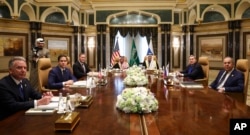 FILE - U.S., Saudi and Russian officials meet at Diriyah Palace, in Riyadh, Saudi Arabia, Feb. 18, 2025. Second left is U.S. Secretary of State Marco Rubio, with Russian Foreign Minister Sergey Lavrov at right. The talks were hosted by Saudi officials.