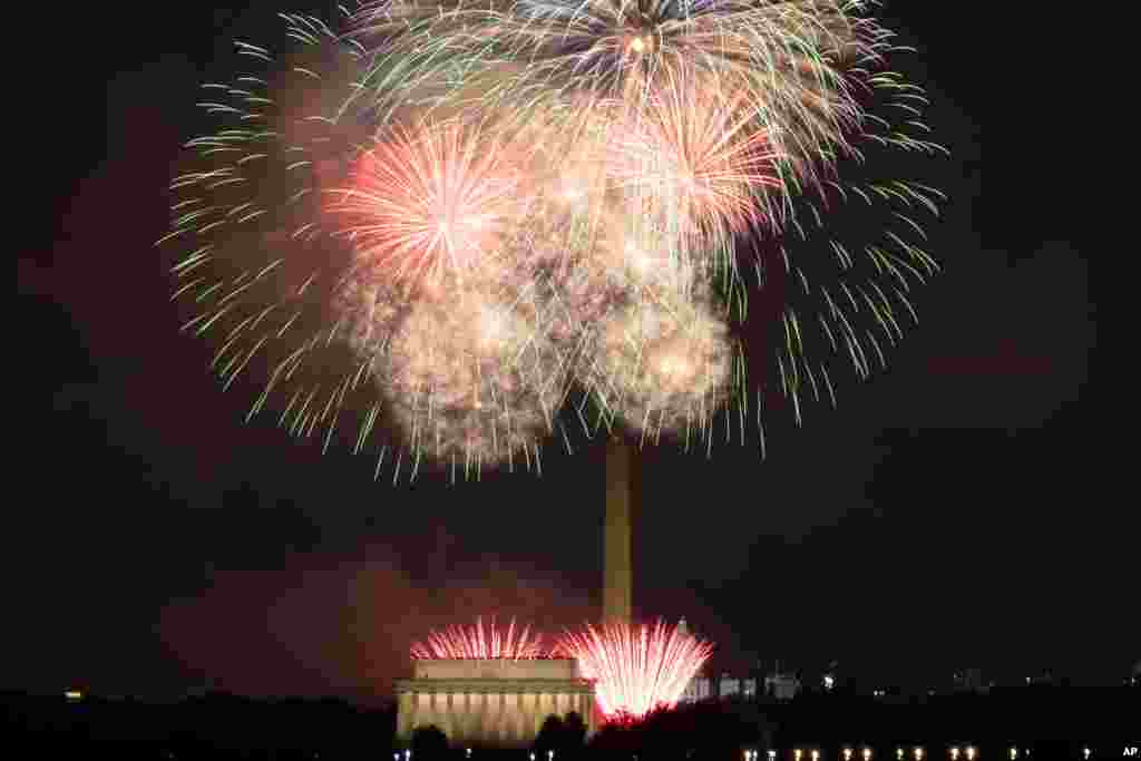 Fireworks explode over Lincoln Memorial, Washington Monument and U.S. Capitol, at the National Mall, during the Independence Day celebrations, in Washington, on July 4, 2021.