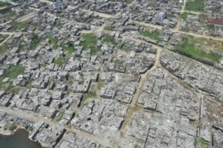 In this photo taken on March 28, 2018 shows an aerial shot of bombed-out houses in Marawi City, after five months of house-to-house fighting between troops and jihadists loyal to the Islamic State.