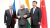 资料照片：俄罗斯总统弗拉基米尔·普京与印度总理纳伦德拉·莫迪和中国国家主席习近平在日本大阪的二十国集团（G20）峰会期间举行会晤。（2019年6月28日）