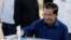 Cambodian Prime Minister Hun Sen of the Cambodian People's Party (CPP) drops a ballot into a box for voting at a polling station at Takhmua in Kandal province, southeast Phnom Penh, Cambodia