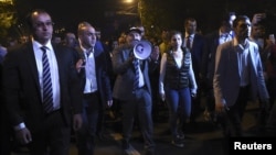 Armenian Prime Minister Nikol Pashinyan (C) addresses supporters during a protest against a bill passed by members of parliament to block the dissolution of the National Assembly, in Yerevan, Armenia, Oct. 2, 2018.