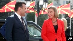 FILE - EU High Representative for Foreign Affairs and Security Policy Federica Mogherini is welcomed by Macedonian PM Zoran Zaev (L) upon arriving in Skopje, Macedonia on April 18, 2018. 