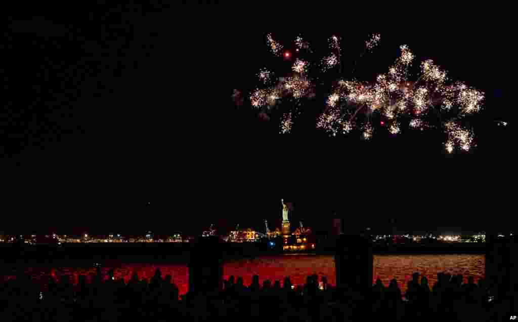 Fireworks explode over New York Harbor and the Statue of Liberty as New York state celebrates a 70% vaccination rate against COVID-19, June 15, 2021.