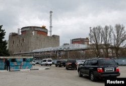 FILE - The International Atomic Energy Agency (IAEA) expert mission, escorted by the Russian military, arrives at the Zaporizhzhia Nuclear Power Plant outside Enerhodar in the Zaporizhzhia region, Russian-controlled Ukraine, March 29, 2023.