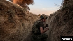 A sapper — or combat engineer — of the Ukrainian Armed Forces' 93rd Kholodnyi Yar Separate Mechanized Brigade takes part in a training session near the front line in Donetsk region, Ukraine, on Oct. 10, 2024. (Radio Free Europe/Radio Liberty via Reuters)