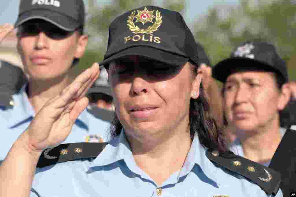 A colleague cries as friends carry the coffin of a police officer killed during a failed military coup last Friday, during his funeral at Kocatepe Mosque in Ankara, Turkey, July 17, 2016. 