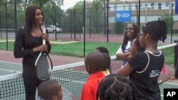 Venus Williams teaches a clinic for some of the children at the Southeast Tennis and Learning Center in Washington, DC, April 28, 2011