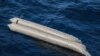 A rubber boat is seen after having capsized with more than 100 migrants on board, during a search and rescue operation in the Mediterranean Sea, off the Libyan Coast, April 22, 2021.