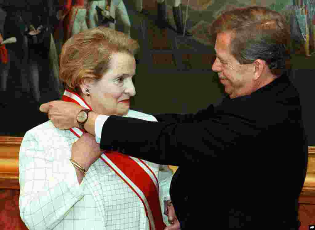 Awarding Secretary of State Madeleine Albright with the highest Czech award of the Order of White Lion at Prague Castle, July 14, 1997. (AP)