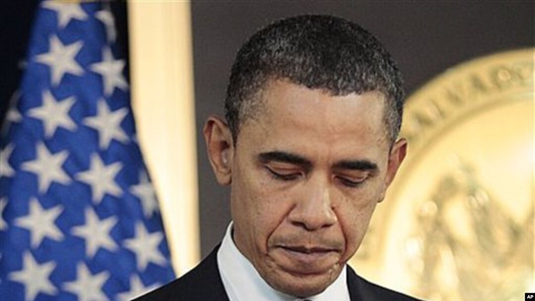 President Barack Obama pauses after answering questions on the ongoing situation in Libya during his joint news conference with President of El Salvador Mauricio Funes at the National Palace in San Salvador, El Salvador, March 22, 2011