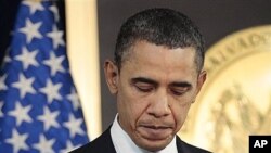 President Barack Obama pauses after answering questions on the ongoing situation in Libya during his joint news conference with President of El Salvador Mauricio Funes at the National Palace in San Salvador, El Salvador, March 22, 2011