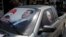 FILE - A poster of Syria's President Bashar al-Assad (L) and a photo of Russian President Vladimir Putin are seen on a car near Latakia, Syria, May 26, 2014.