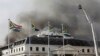 Smoke rises from the Parliament in Cape Town, South Africa, Jan 3, 2022, after the fire re-ignited late afternoon.