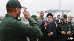 A handout picture made available by the Iranian presidential office on Feb. 2, 2024, shows Iranian President Ebrahim Raisi visiting the Islamic Revolutionary Guard Corps navy base in Bandar Abbas, Iran. (Iranian presidential office via AFP)