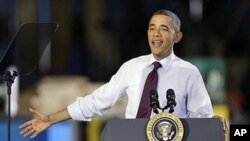 President Barack Obama speaks about manufacturing jobs, at the Conveyor Engineering & Manufacturing plant in Cedar Rapids, Iowa, January 25, 2012.