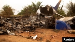 Wreckage is seen from a Douglas DC-3 passenger aircraft which crashed on the Colombian plains province of Meta, San Martin, Colombia, March 9, 2019. 