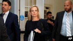 Homeland Security Secretary Kirstjen Nielsen, center, arrives for a closed doors meeting with the Congressional Hispanic Caucus, July 25, 2018, on Capitol Hill in Washington.