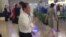 In this image made from video, Kim Yong Chol, in white, a former military intelligence chief who is now Kim Jong Un's top official on inter-Korean relations, walks upon arrival at Beijing airport in Beijing, May 29, 2018. 